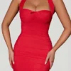 Aisha Bow-Embellished Ruched Halterneck Mini Dress in Red