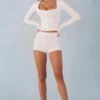 Amoura Knit Mid-Rise Mini Shorts in Ivory