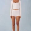 Amoura Knit Mid-Rise Mini Shorts in Ivory