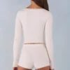 Amoura Knit Mid-Rise Mini Shorts in Ivory