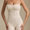 Arlena Bow-Detail Lace Flared Jumpsuit in Ivory
