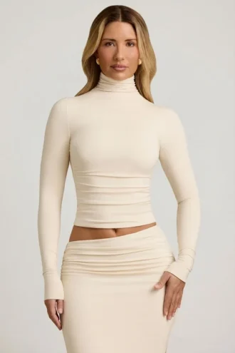 Auri Modal Ruched Backless Turtleneck Top in Ivory