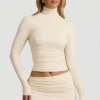 Auri Modal Ruched Backless Turtleneck Top in Ivory