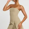 Bruna Woven Twill Wrap Over Pleated Mini Dress in Taupe