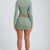 Cali Modal Ruched Mid-Rise Mini Skirt in Sage Green