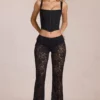 Calista Sheer Lace Mid-Rise Flared Trousers in Black