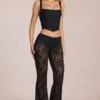 Calista Sheer Lace Mid-Rise Flared Trousers in Black