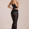 Calista Sheer Lace Mid-Rise Flared Trousers in Black