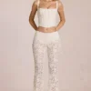 Calista Sheer Lace Mid-Rise Flared Trousers in Ivory
