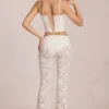 Calista Sheer Lace Mid-Rise Flared Trousers in Ivory