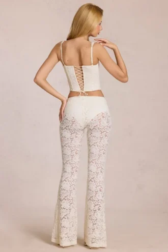 Calista Sheer Lace Mid-Rise Flared Trousers in Ivory