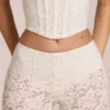 Calista Sheer Lace Mid-Rise Flared Trousers in Ivory