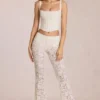Calista Sheer Lace Mid-Rise Flared Trousers in Ivory