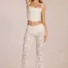 Calista Sheer Lace Mid-Rise Flared Trousers in Ivory
