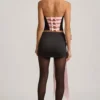 Carola Satin Bow-Detail Low-Rise Mini Skirt in Black