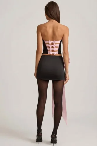 Carola Satin Bow-Detail Low-Rise Mini Skirt in Black
