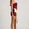 Carola Satin Bow-Detail Low-Rise Mini Skirt in Wine Red