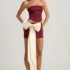 Carola Satin Bow-Detail Low-Rise Mini Skirt in Wine Red