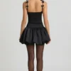 Cirilla Bow-Detail Ruched Bubble Hem Mini Dress in Black