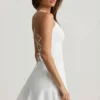 Daria Drop-Waist Lace-Up Mini Dress in White