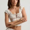Faela Ruched Cotton-Poplin Corset Top in Rose Print