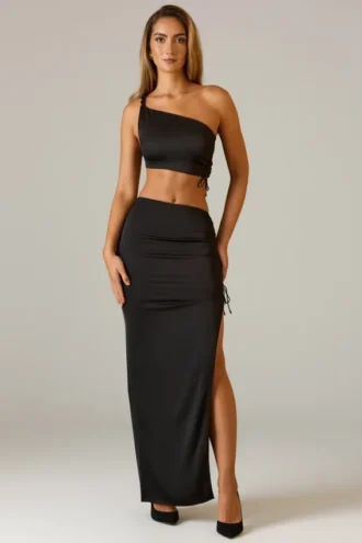 Ishaana Ruched Asymmetric-Waist Maxi Skirt in Black