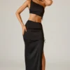 Ishaana Ruched Asymmetric-Waist Maxi Skirt in Black