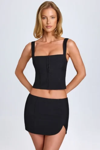 Issa Curved Low-Rise Mini Skirt in Black