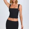 Issa Curved Low-Rise Mini Skirt in Black