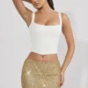 Jianna Embellished Low-Rise Mini Skirt in Gold