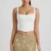 Jianna Embellished Low-Rise Mini Skirt in Gold