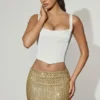 Jianna Embellished Low-Rise Mini Skirt in Gold