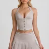 Laika Low-Rise Pleated Mini Skirt in Ecru