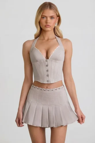 Laika Low-Rise Pleated Mini Skirt in Ecru