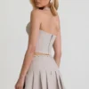 Laika Low-Rise Pleated Mini Skirt in Ecru
