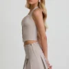 Laika Low-Rise Pleated Mini Skirt in Ecru