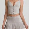 Laika Low-Rise Pleated Mini Skirt in Ecru