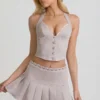 Laika Low-Rise Pleated Mini Skirt in Ecru