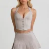 Laika Low-Rise Pleated Mini Skirt in Ecru