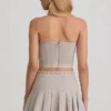 Laika Low-Rise Pleated Mini Skirt in Ecru