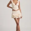 Lorena Layered Ruffled Low-Rise Mini Skirt in Ivory