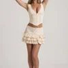 Lorena Layered Ruffled Low-Rise Mini Skirt in Ivory
