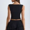 Nada Layered Pleated Low-Rise Mini Skirt in Black