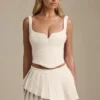 Nada Layered Pleated Low-Rise Mini Skirt in Ivory Nada Layered Pleated Low-Rise Mini Skirt in Ivory