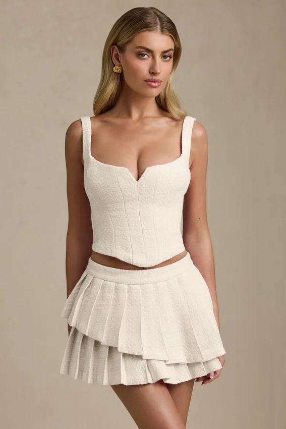 Nada Layered Pleated Low-Rise Mini Skirt in Ivory Nada Layered Pleated Low-Rise Mini Skirt in Ivory