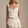 Nada Layered Pleated Low-Rise Mini Skirt in Ivory Nada Layered Pleated Low-Rise Mini Skirt in Ivory