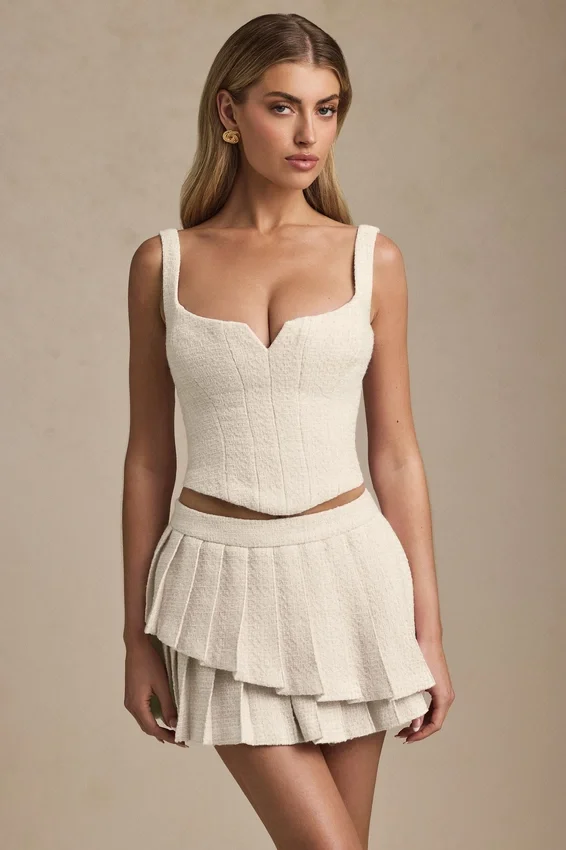 Nada Layered Pleated Low-Rise Mini Skirt in Ivory Nada Layered Pleated Low-Rise Mini Skirt in Ivory