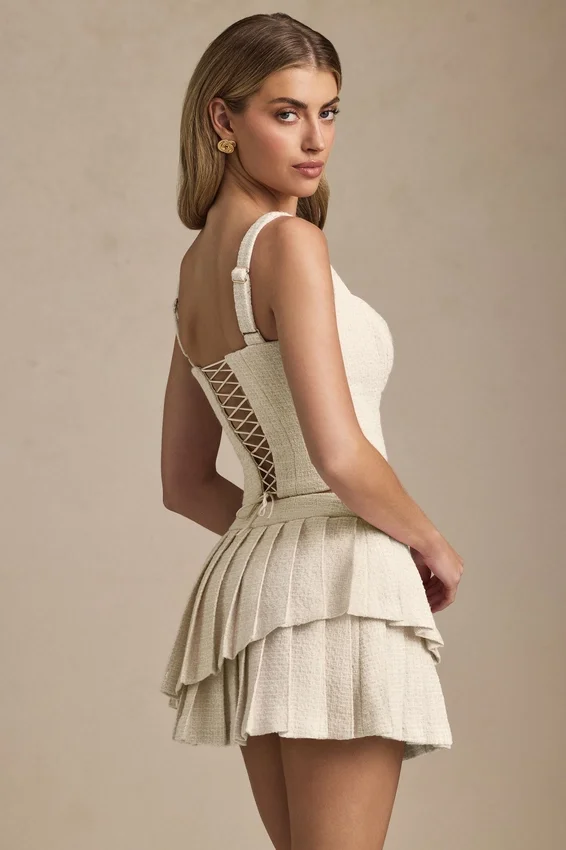 Nada Layered Pleated Low-Rise Mini Skirt in Ivory Nada Layered Pleated Low-Rise Mini Skirt in Ivory