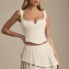 Nada Layered Pleated Low-Rise Mini Skirt in Ivory Nada Layered Pleated Low-Rise Mini Skirt in Ivory