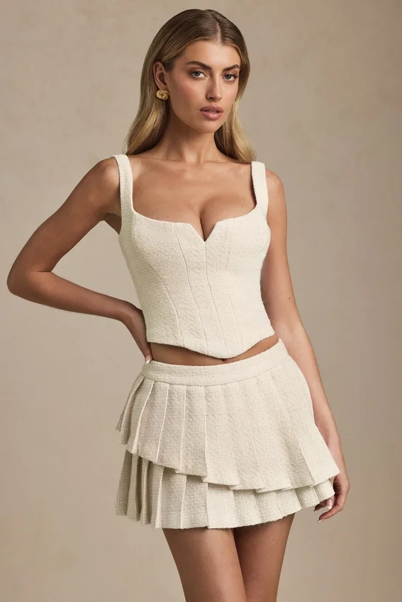 Nada Layered Pleated Low-Rise Mini Skirt in Ivory Nada Layered Pleated Low-Rise Mini Skirt in Ivory